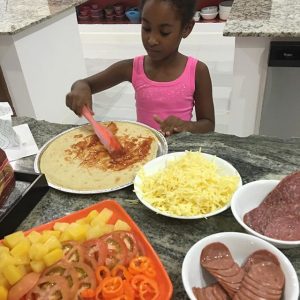 Fay Ann's daughter, Syri gets in on the kitchen action. 