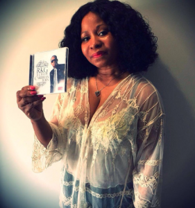 Carol Maharaj- the mother of Internationally recognized, rapper, Nicki Minaj, is seen holding the Caribbean Born album. 
